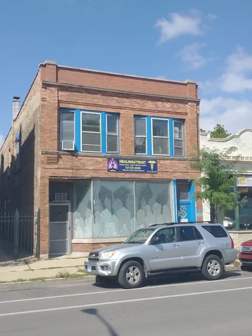 a front view of a house with parking space