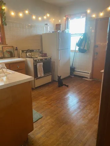 a kitchen with stainless steel appliances a refrigerator and a sink
