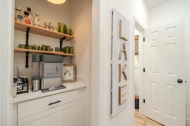 a bathroom with a sink mirror vanity and toilet