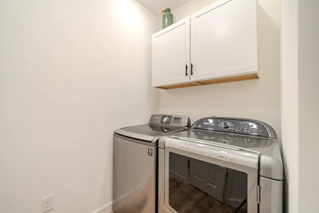 a view of an entryway with wooden floor