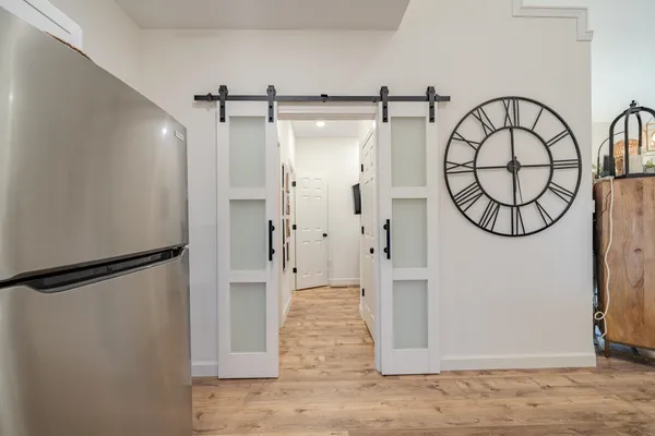 a bedroom with a bed and a chandelier