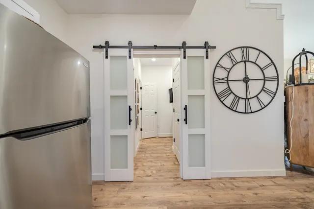 a bedroom with a bed and a chandelier