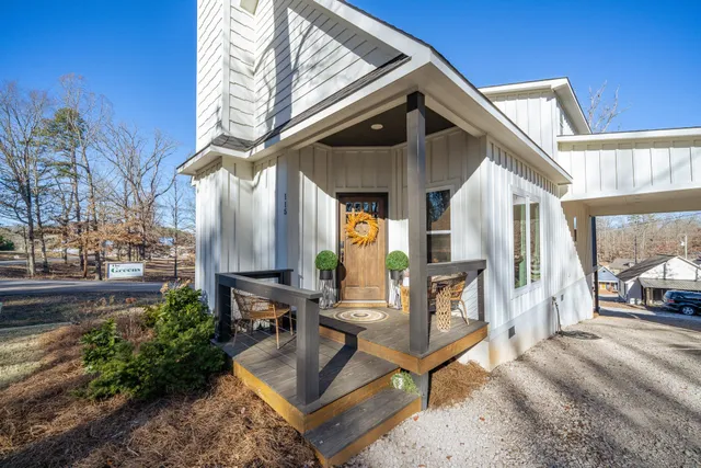 a building outdoor space with patio furniture and potted plants