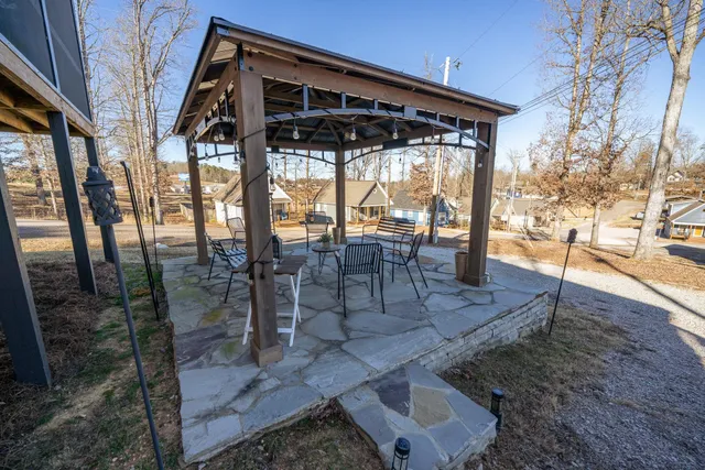 a building outdoor space with patio furniture and potted plants