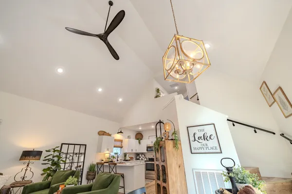 a view of a livingroom with furniture and stairs