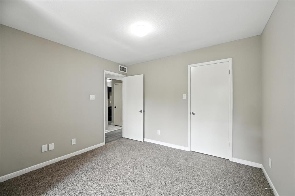 8545 Midpark Road, Unit 66 Dallas, TX 75240 - Photo 11 of 27 a view of an empty room and closet area