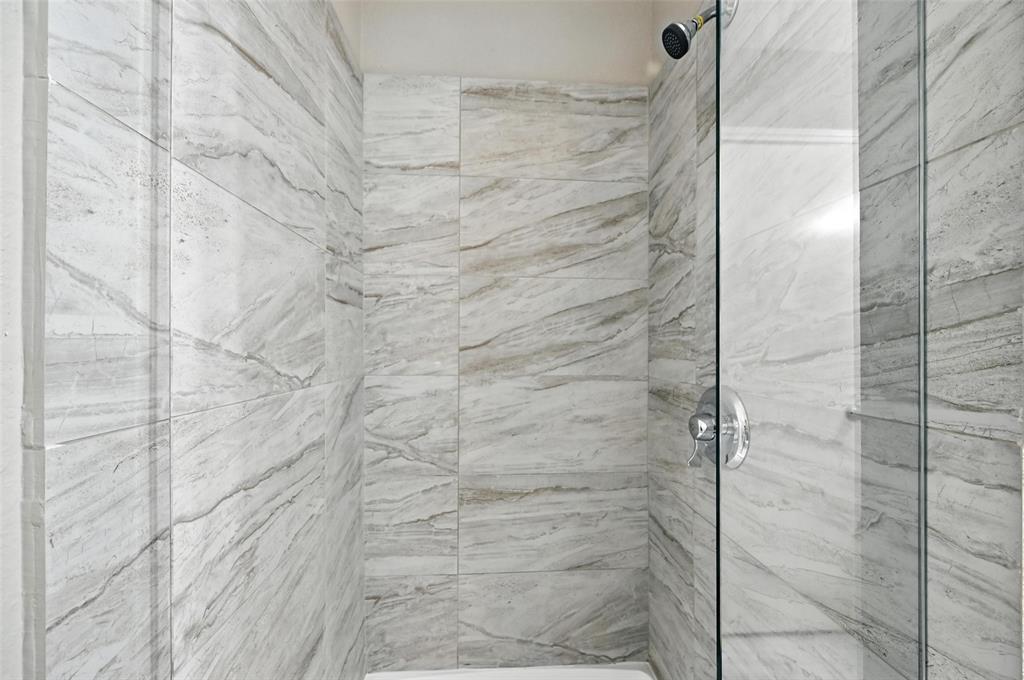 8545 Midpark Road, Unit 66 Dallas, TX 75240 - Photo 16 of 27 a bathroom with a shower