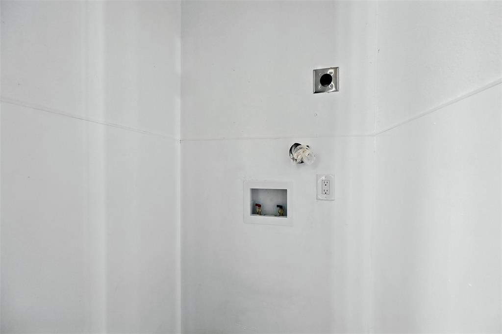 8545 Midpark Road, Unit 66 Dallas, TX 75240 - Photo 17 of 27 a white wall with a shower in it