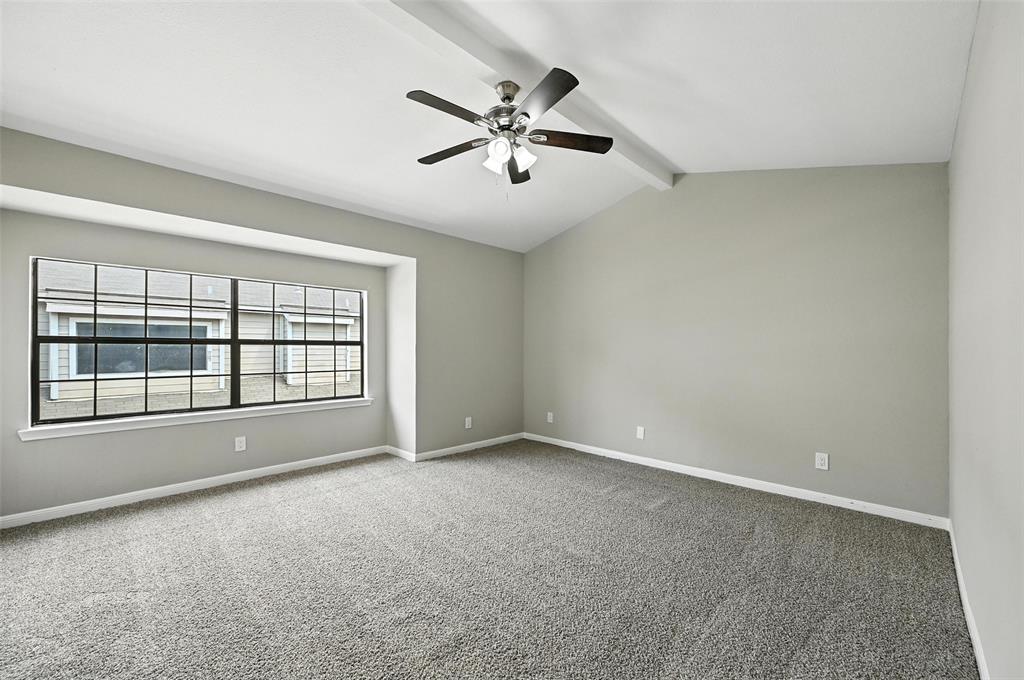 8545 Midpark Road, Unit 66 Dallas, TX 75240 - Photo 18 of 27 a view of an empty room with a window