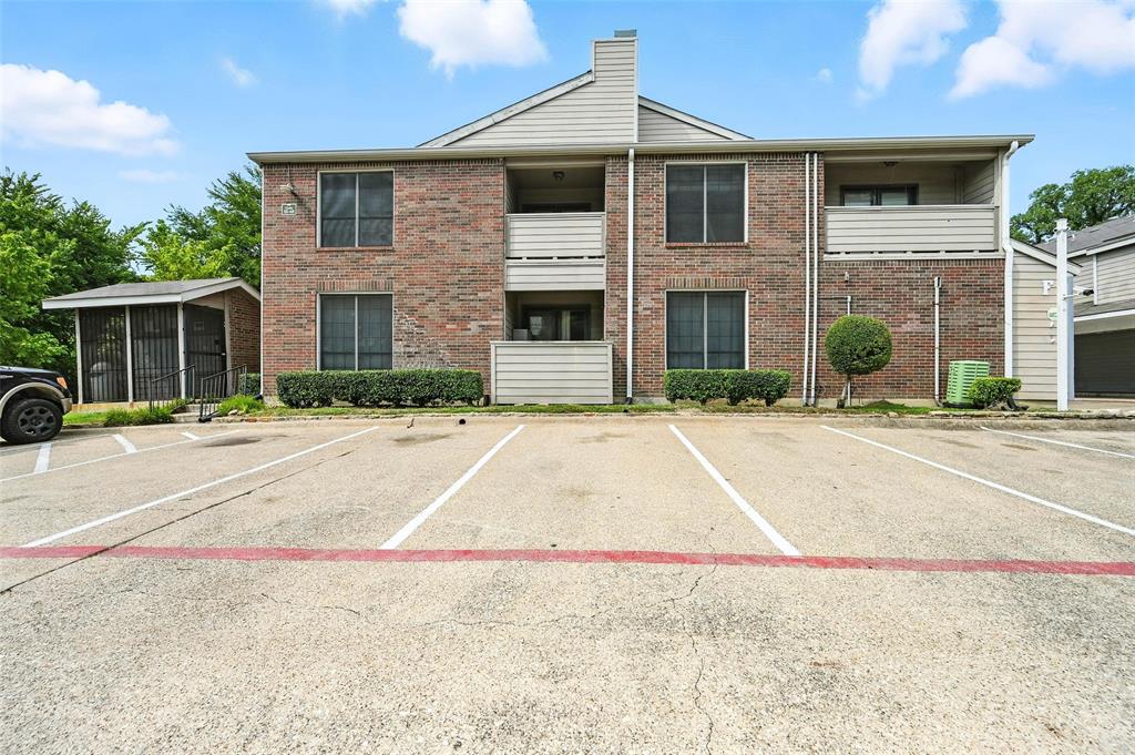 8545 Midpark Road, Unit 66 Dallas, TX 75240 - Photo 25 of 27 a front view of a house with a yard