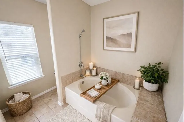 a bathroom with a sink a tub and a mirror