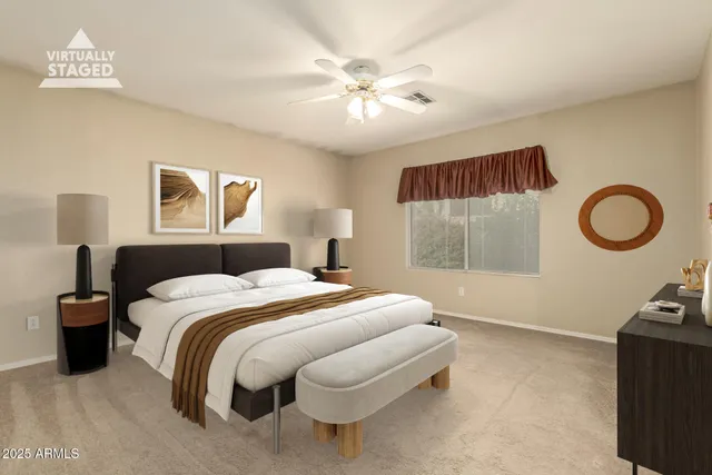 a bedroom with a bed and a ceiling fan