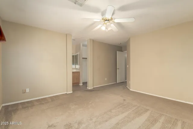 an empty room with fan