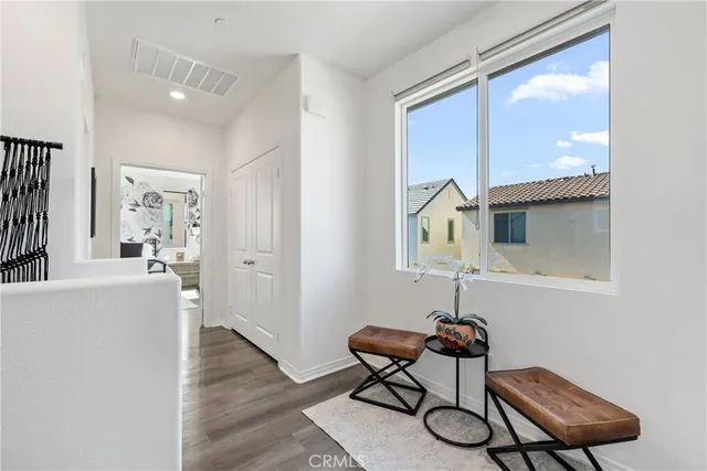 a bedroom with a large bed and a tv