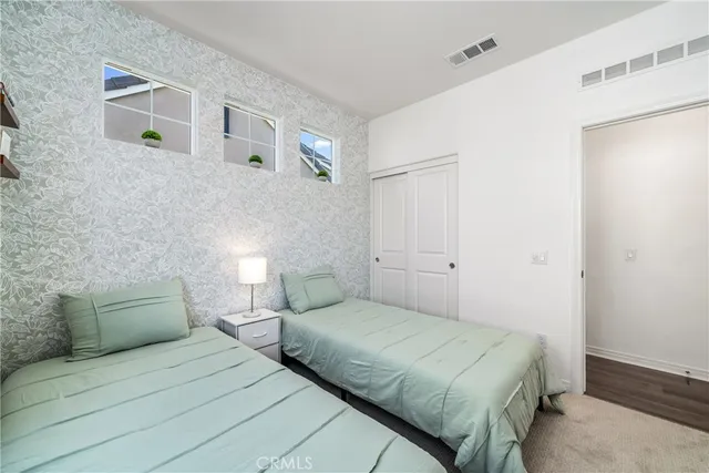 a view of a house with swimming pool and sitting area