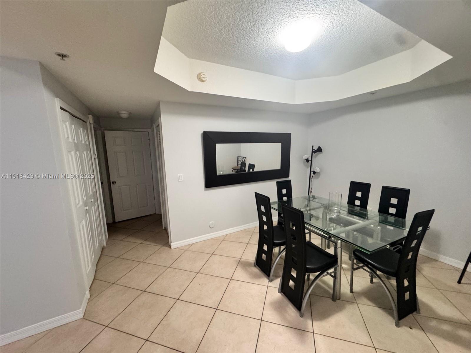 6340 Northwest 114th Avenue, Unit 101 Doral, FL 33178 - Photo 4 of 16 a view of a dining room with furniture