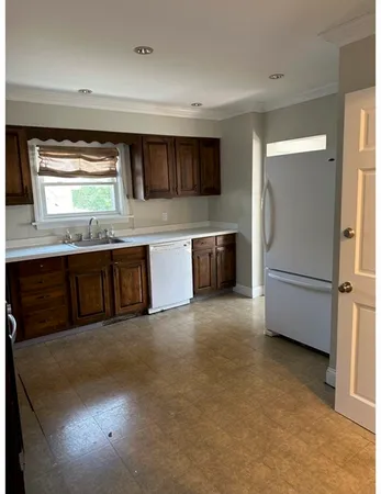 a kitchen with stainless steel appliances a stove and a refrigerator