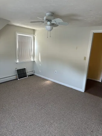 a view of a room with rack and wooden floor