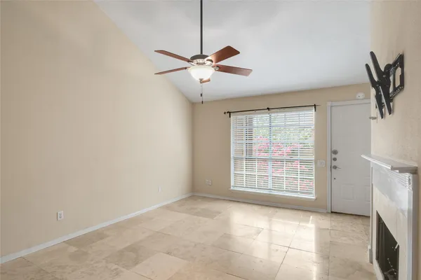 a view of an empty room with a window