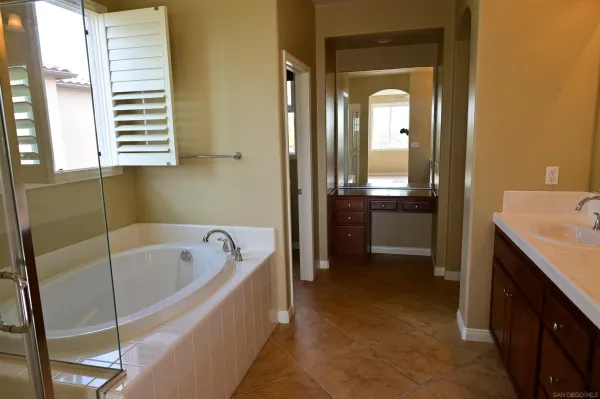 a bathroom with a bathtub and a sink