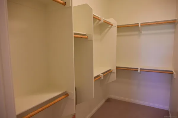 a view of an empty walk in closet