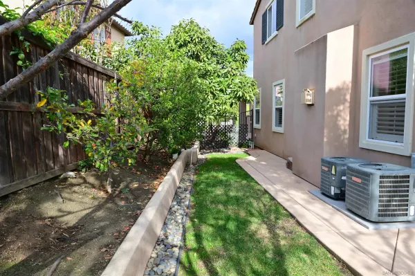 a view of a backyard with potted plants