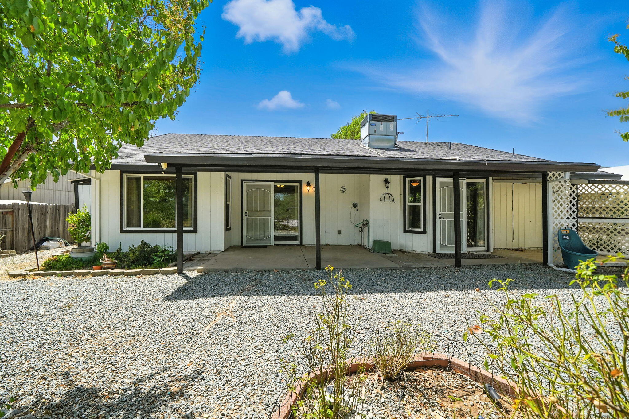 3588 Magnums Way Redding, CA 96003 - Photo 20 of 35 a front view of a house with garden