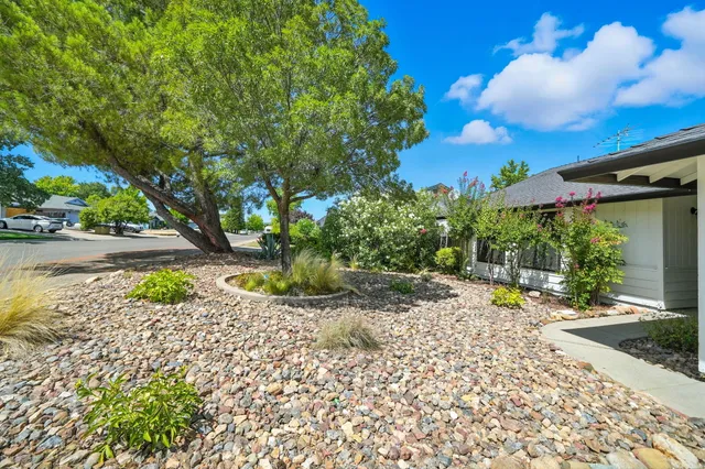 a view of a backyard with a patio