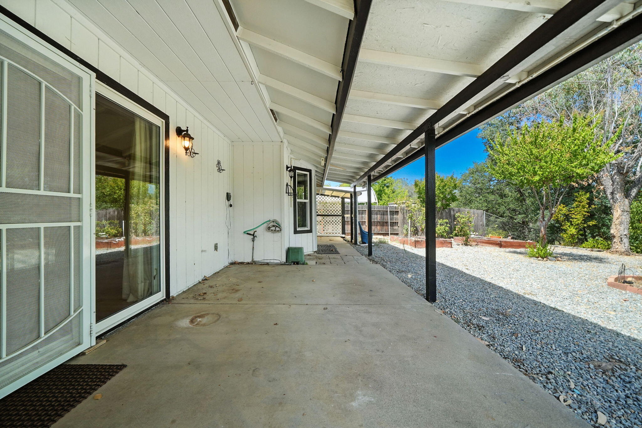 3588 Magnums Way Redding, CA 96003 - Photo 22 of 35 a view of an empty room with wooden floor and windows