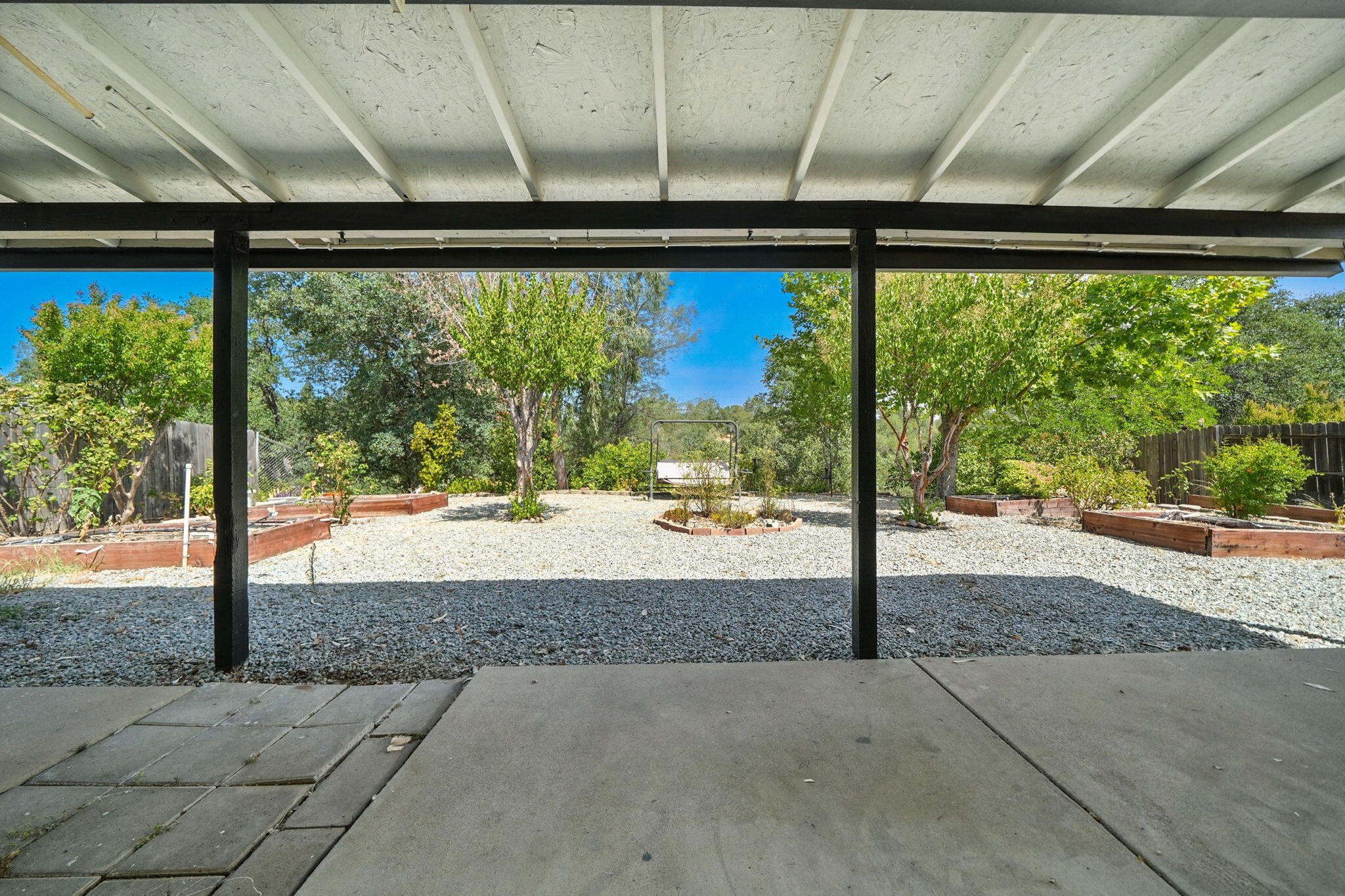 3588 Magnums Way Redding, CA 96003 - Photo 23 of 35 a view of a room with a large window and wooden floor