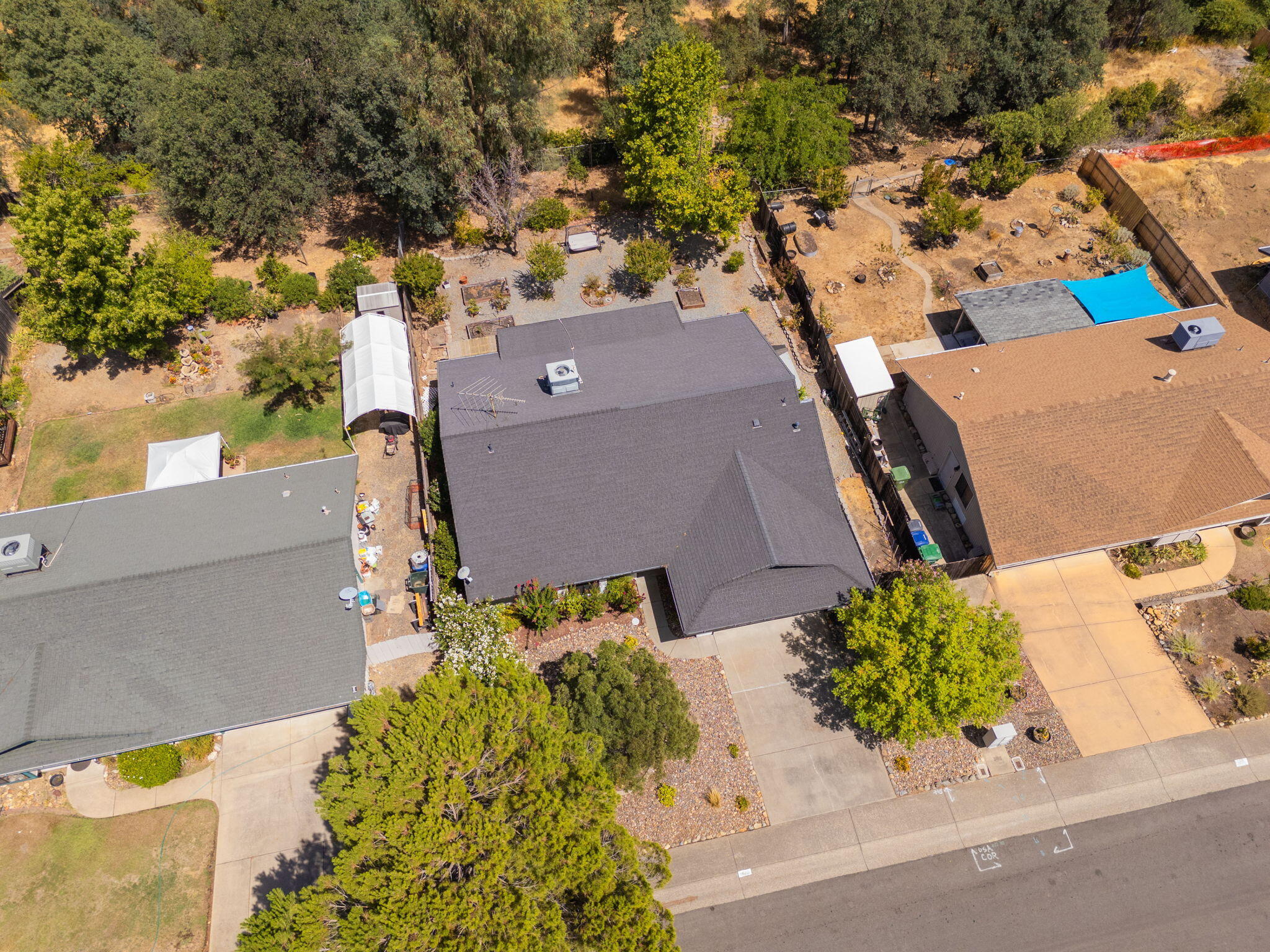 3588 Magnums Way Redding, CA 96003 - Photo 31 of 35 an aerial view of a house with a yard and a large tree