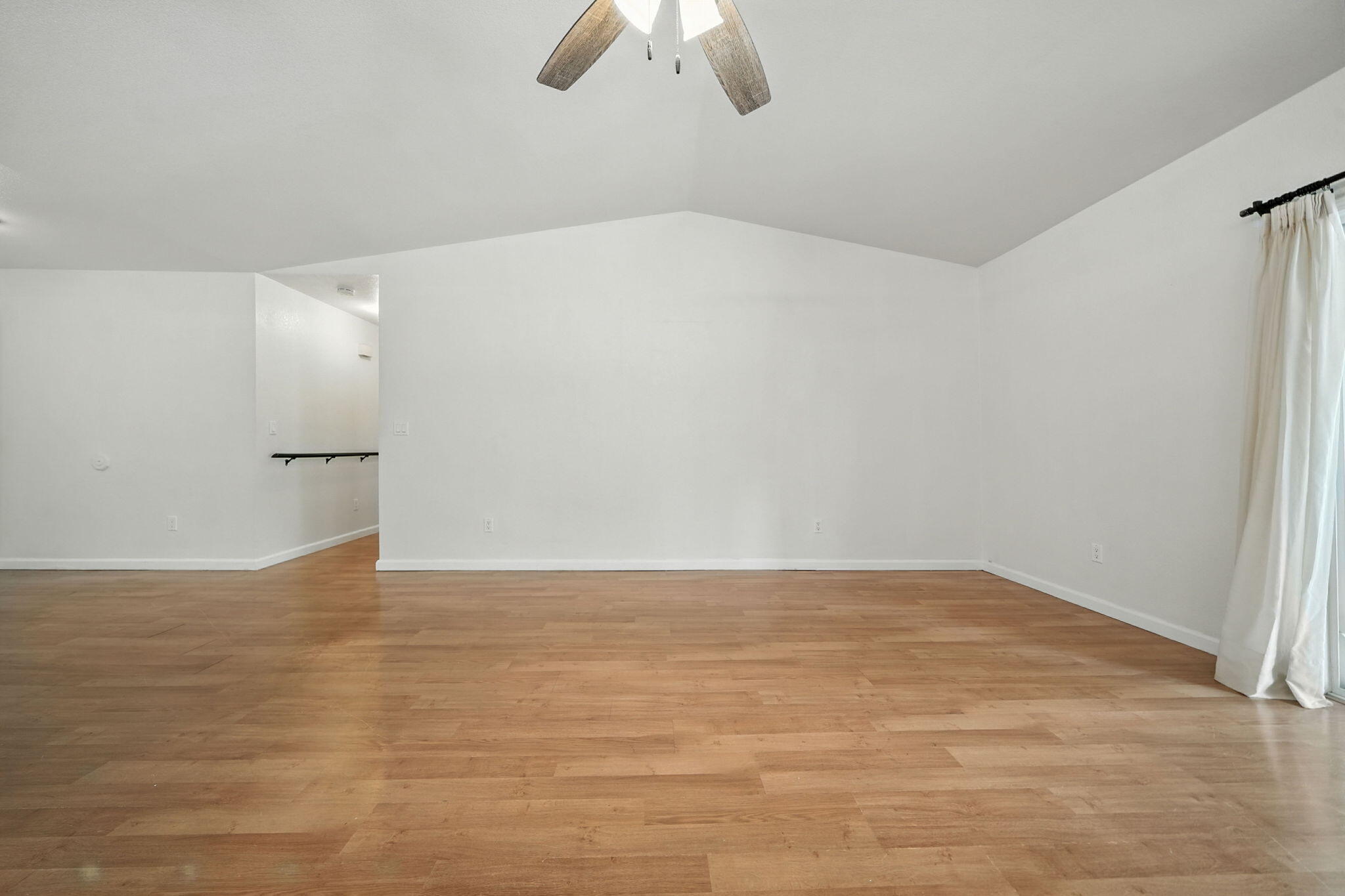 3588 Magnums Way Redding, CA 96003 - Photo 5 of 35 a view of an empty room with wooden floor and chandelier fan