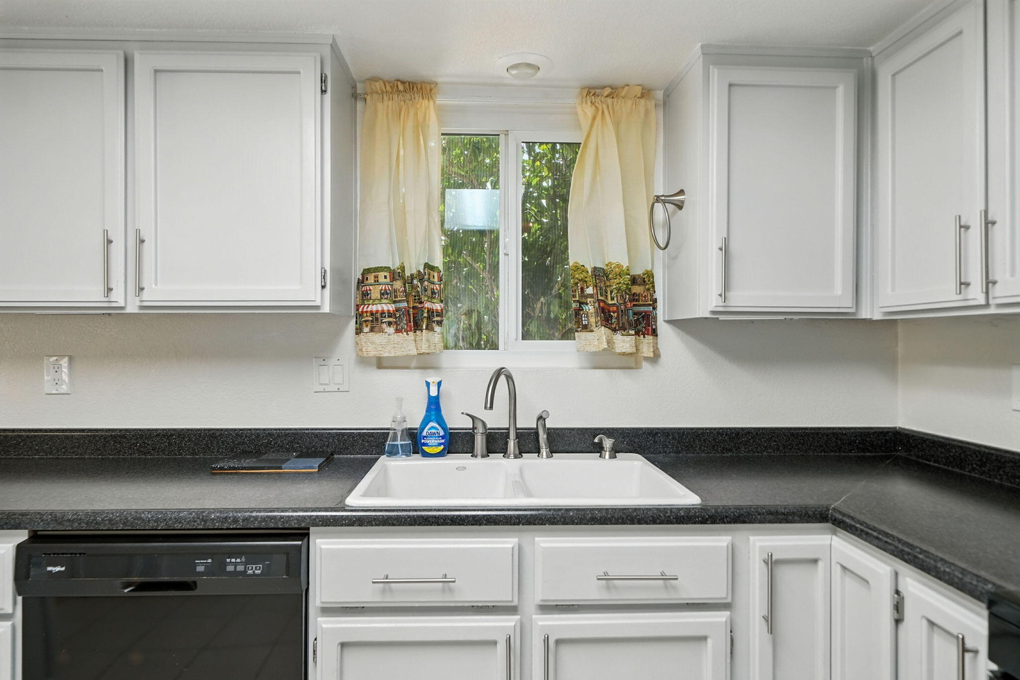 3588 Magnums Way Redding, CA 96003 - Photo 9 of 35 a kitchen with a sink and cabinets