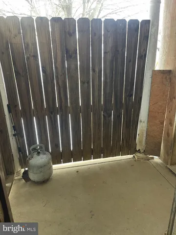 a view of a chair with wooden fence