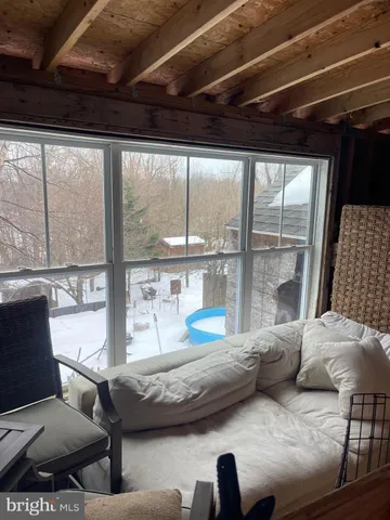 a room with wooden floor and furniture