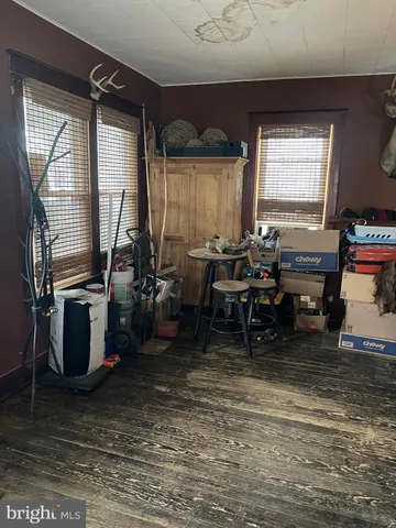a living room with furniture a window and a table