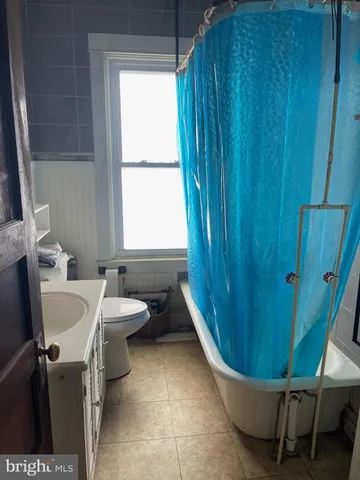 a bathroom with a sink and toilet