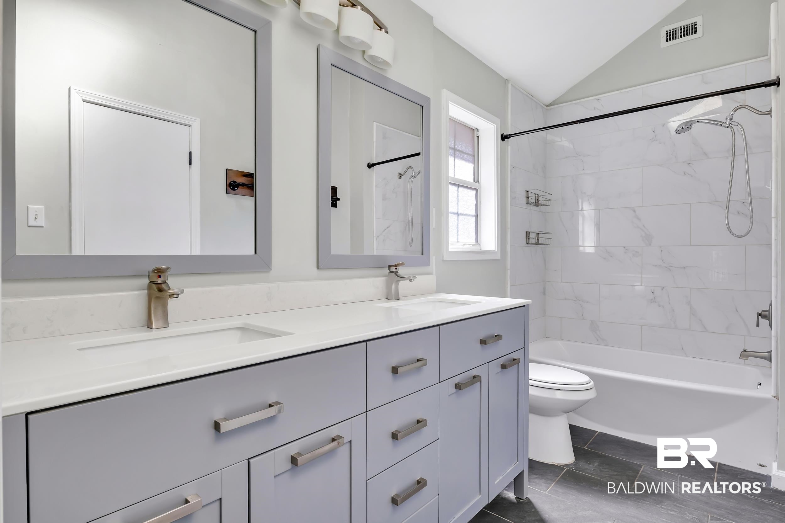 6616 Conde Court Mobile, AL 36695 - Photo 18 of 27 Bathroom with a sink, toilet, double vanity, and vaulted ceiling