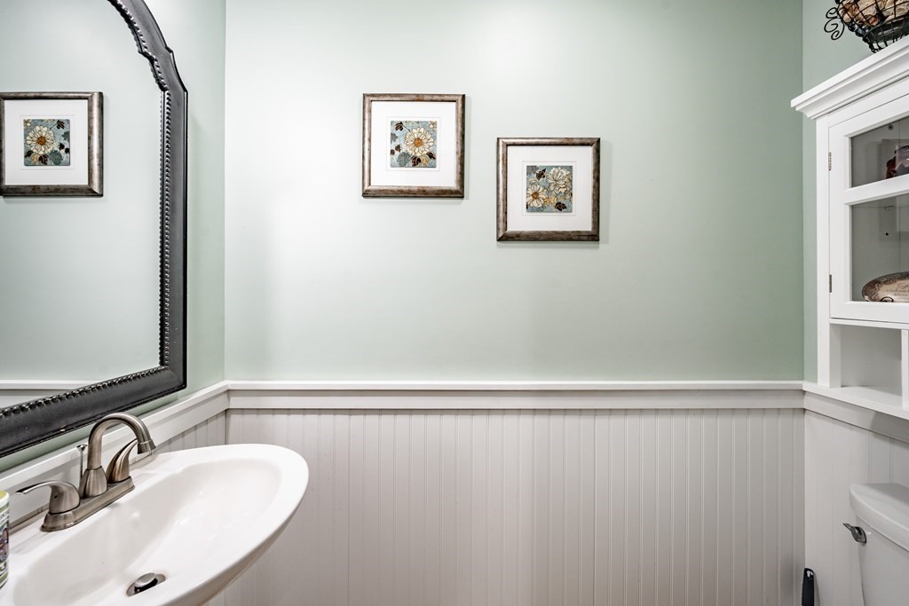 79 Judson Street Springfield, MA 01104 - Photo 19 of 38 a bathroom with a sink and a mirror