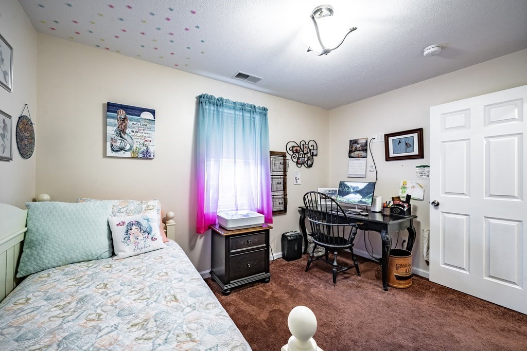79 Judson Street Springfield, MA 01104 - Photo 25 of 38 a bedroom with a bed a desk and chair
