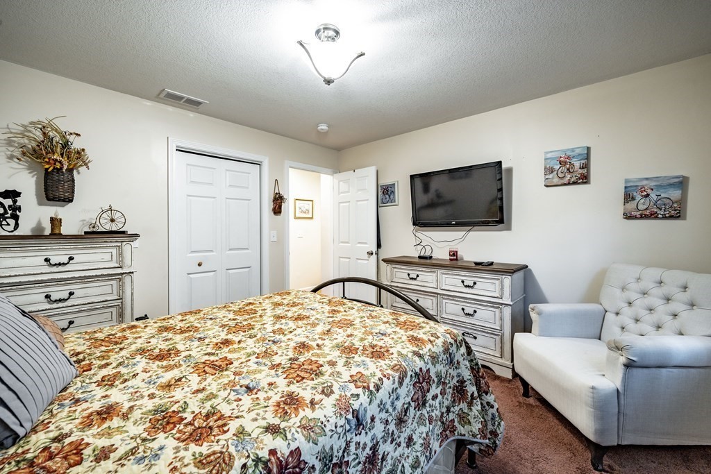 79 Judson Street Springfield, MA 01104 - Photo 28 of 38 a bedroom with a bed and furniture