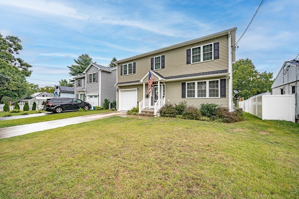 79 Judson Street Springfield, MA 01104 - Photo 3 of 38 a front view of a house with a garden