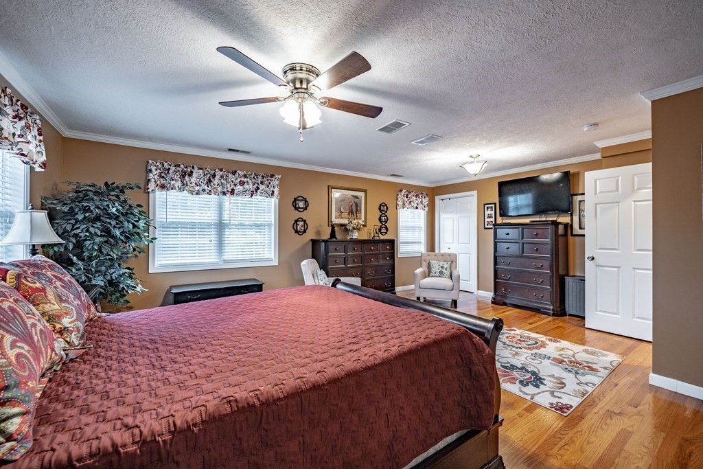 79 Judson Street Springfield, MA 01104 - Photo 32 of 38 a bed sitting in a spacious bedroom next to a window