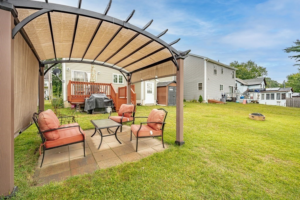 79 Judson Street Springfield, MA 01104 - Photo 36 of 38 a view of swimming pool with outdoor seating and yard