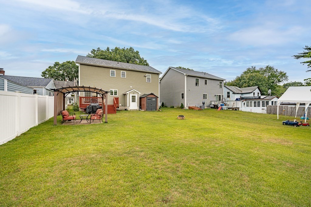 79 Judson Street Springfield, MA 01104 - Photo 37 of 38 a view of a house with a yard and sitting area