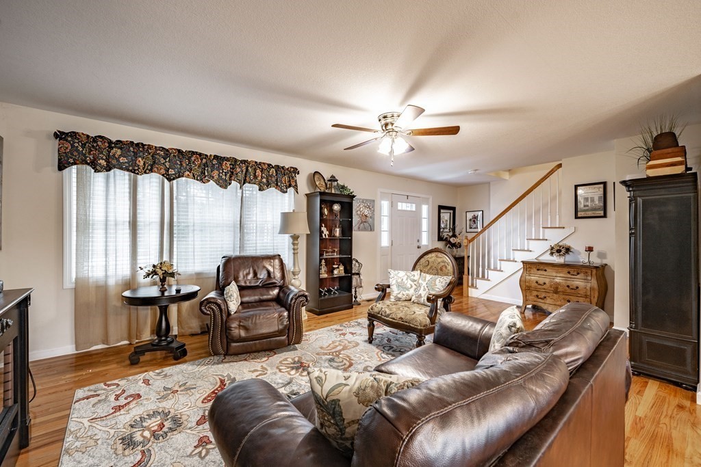 79 Judson Street Springfield, MA 01104 - Photo 9 of 38 a living room with furniture fireplace and large windows