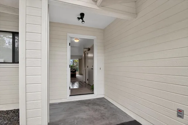 a view of a livingroom with furniture and windows