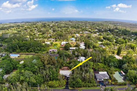 aerial view of a house with swimming pool garden and barbeque oven