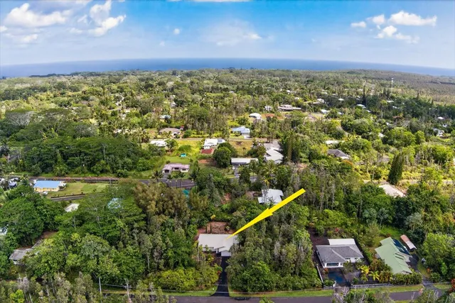 aerial view of a house with swimming pool garden and barbeque oven
