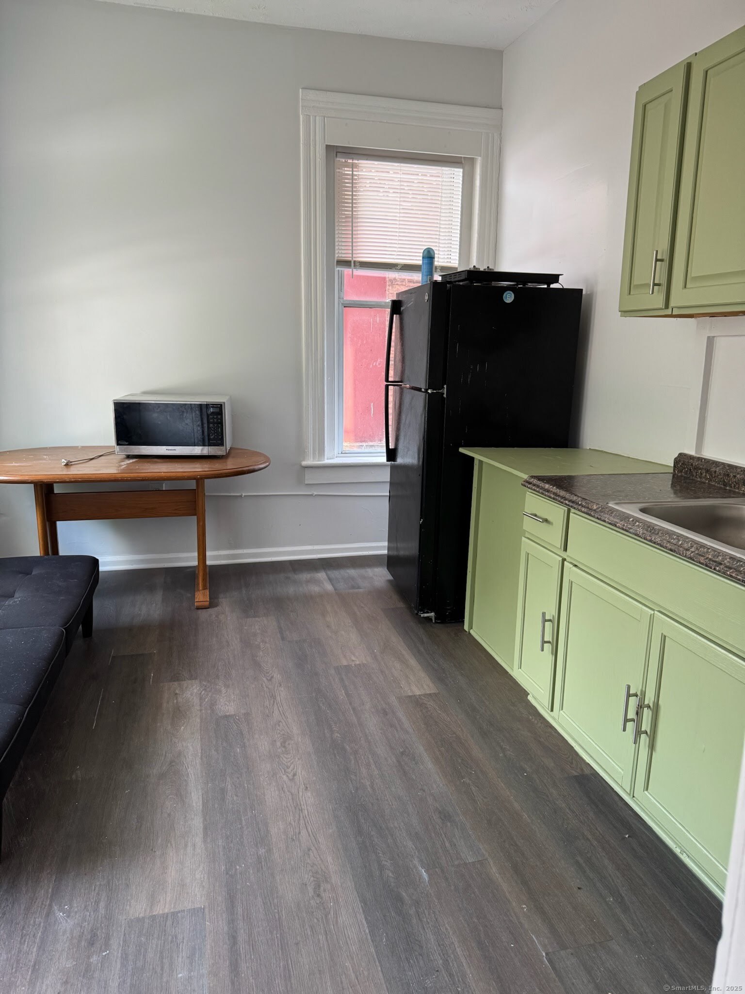 81 West Main Street, Unit 8 Meriden, CT 06451 - Photo 2 of 4 a living room with furniture and a wooden floor